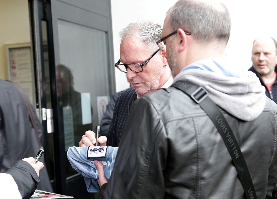  The former footy star signed autographs as he made his way into court in Dudley