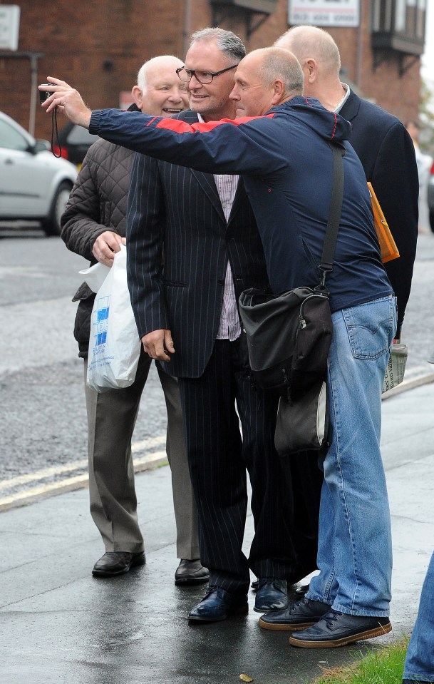  He posed for a series of selfies with fans on his way into Court