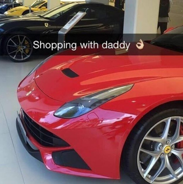  A girl snaps up a Ferrari while out shopping with her dad