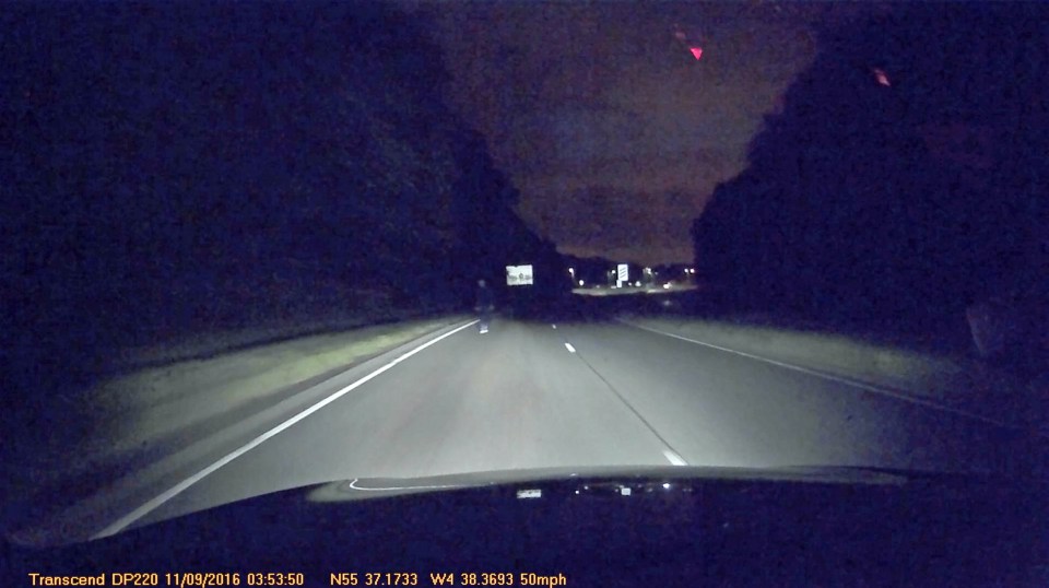  Dashcam footage shows the outline of a man walking down a 50mph A-road in Scotland