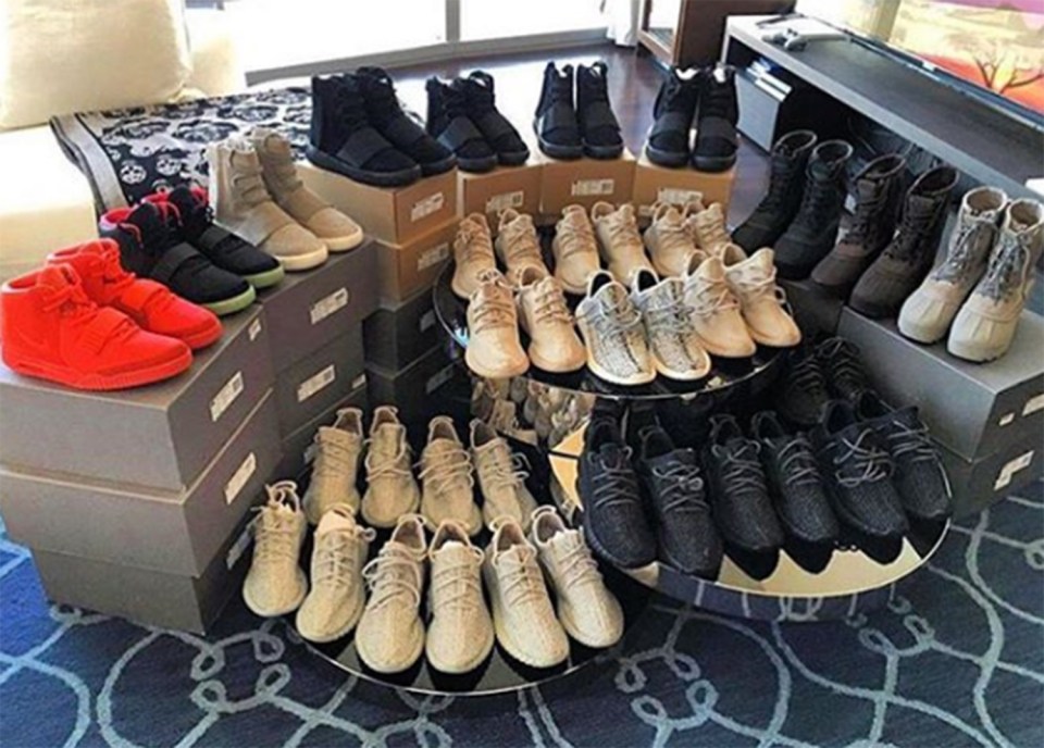  A guy shows off his haul of Kanye West trainers