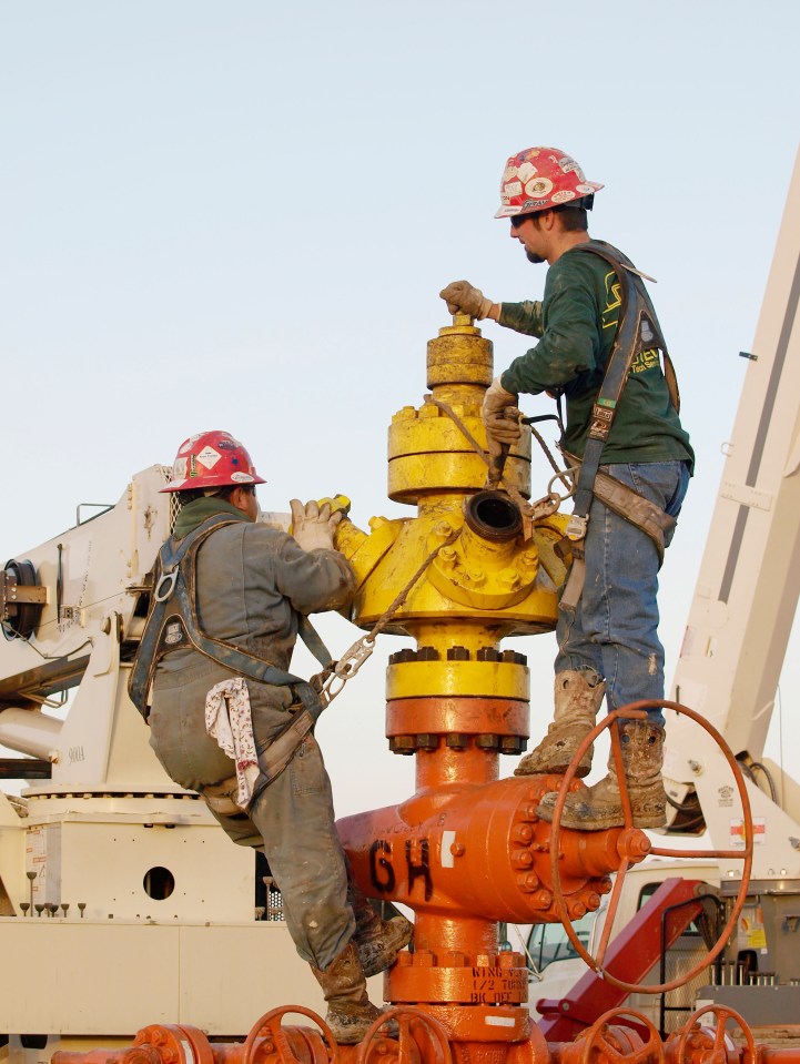  A well head being connected to high pressure pipes for hydraulic fracturing