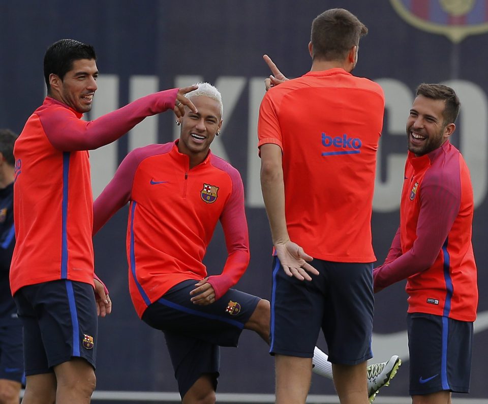  Luis Suarez, Neymar, Gerard Pique, and Jordi Alba share a joke in training, showing the Barca spirit