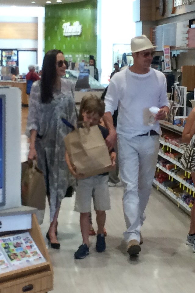  Brad and Angelina with son Knox in a pharmacy earlier this summer