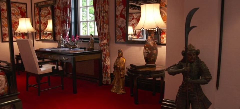  One of the house's 14 bedrooms with Oriental themed decor