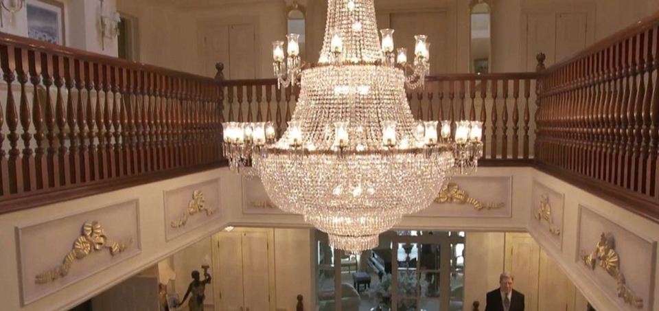  A massive chandelier hangs in the hallway