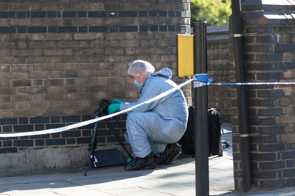  A forensic officer working at the scene after the tragedy