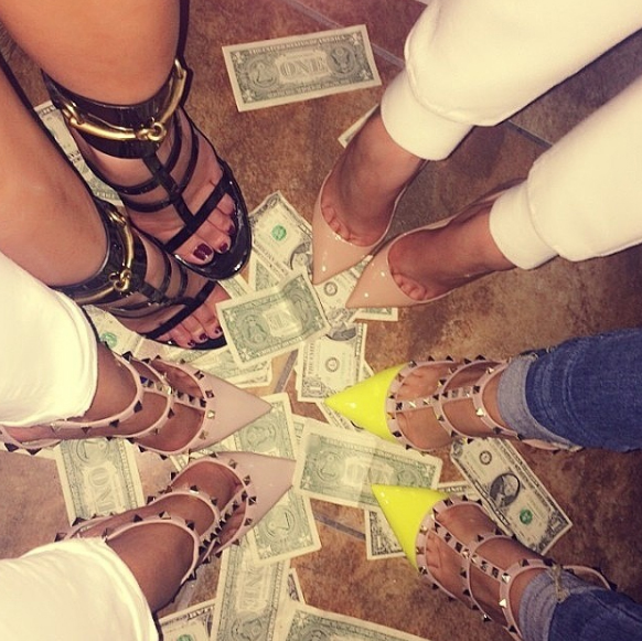  Girls dance on piles of cash