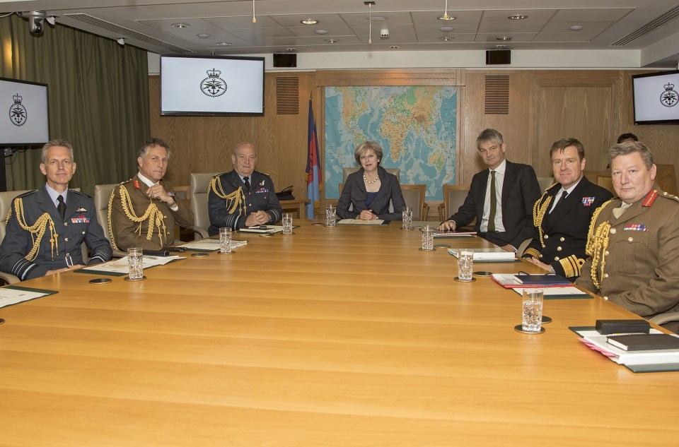 Big guns . . . PM Theresa May with chiefs