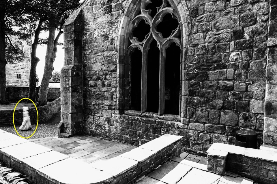  Mark Whitaker was shocked to spot a female figure walking in the background of a photograph taken at a 900-year-old castle