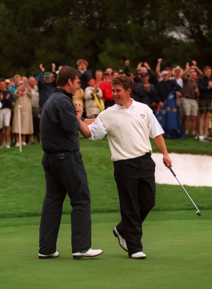  Europe's Lee Westwood (right) and Nick Faldo (left) celebrate victory at the 16th hole against USA's Justin Leonard and Jeff Maggert in 1997