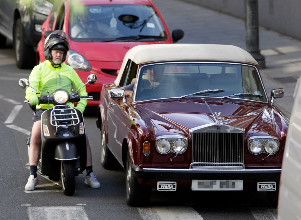  Steve McFadden took to the road in his scooter while his pal rode his Rolls Royce