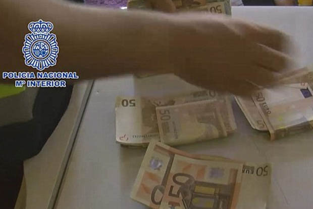  Police found huge bundles of 50 euro notes stuffed into shoes in one of the raids