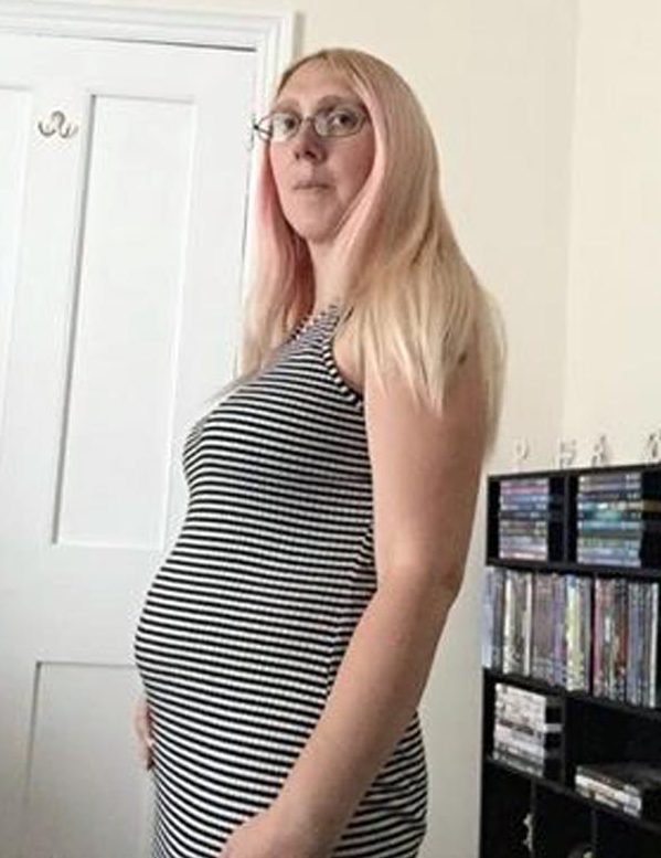  Emma shows off her baby bump while 19 weeks pregnant