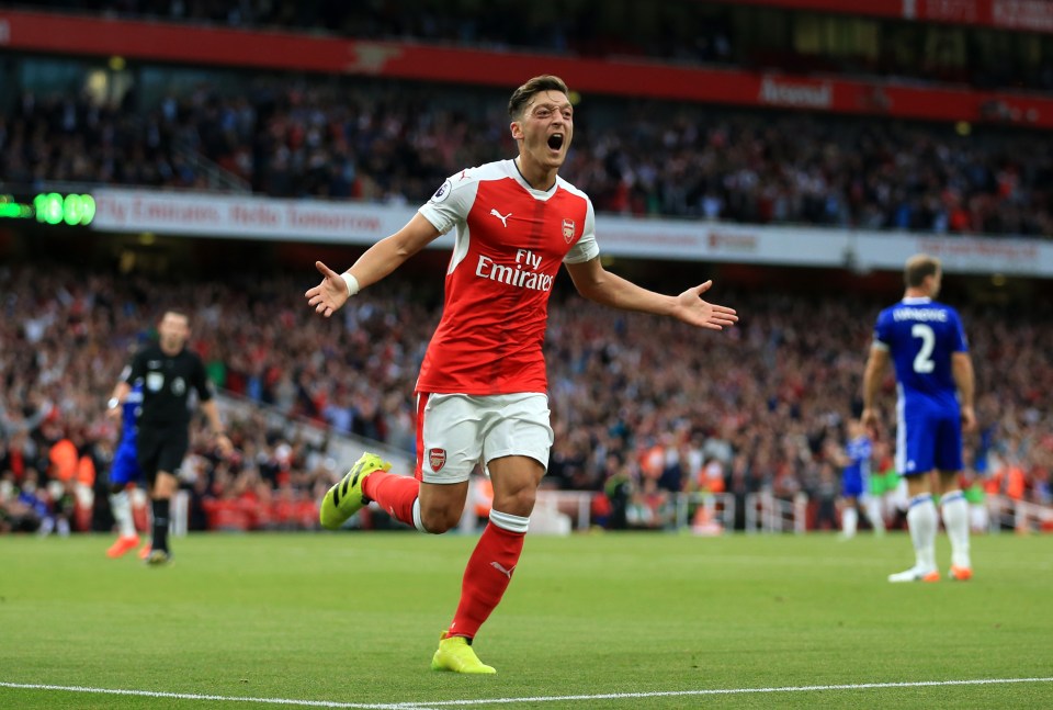  Mesut Ozil celebrates scoring Arsenal's 3rd