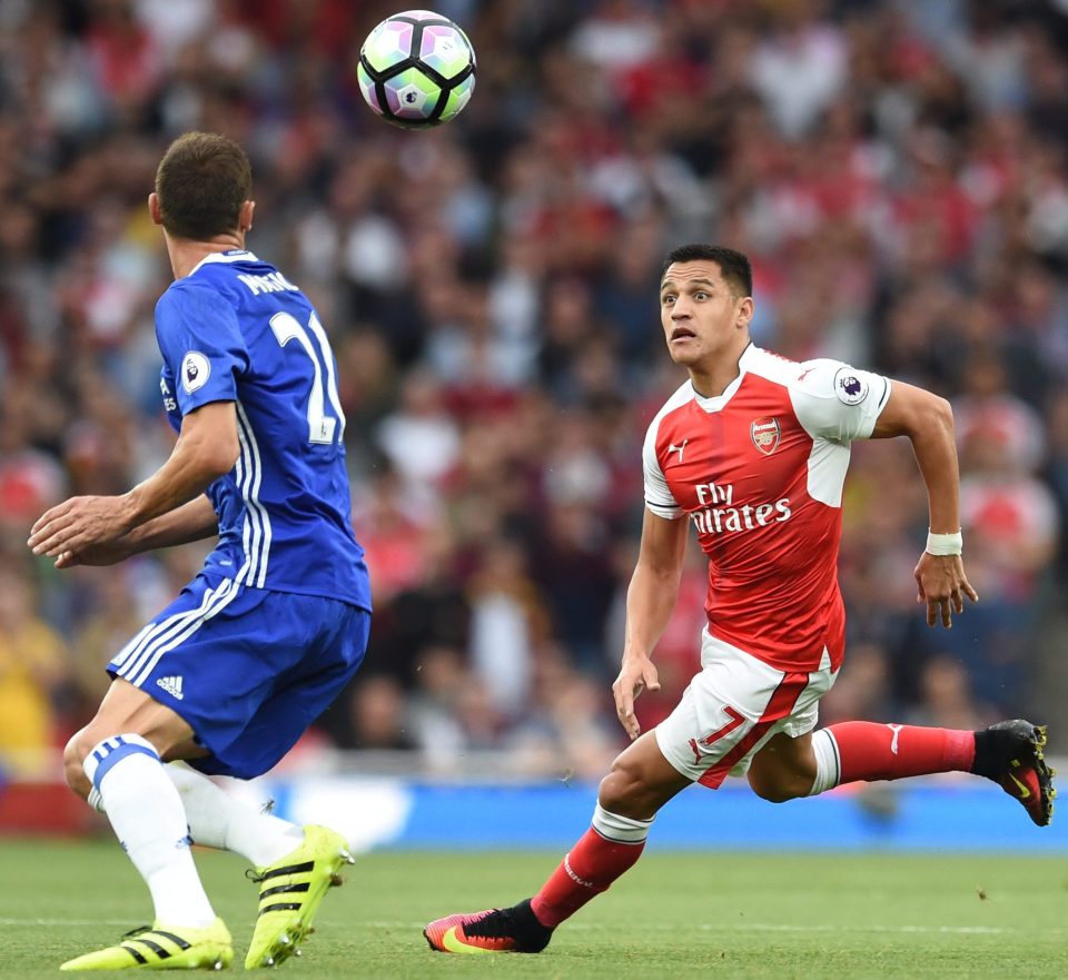  Sanchez vies with Chelsea's Nemanja Matic in the 3-0 win