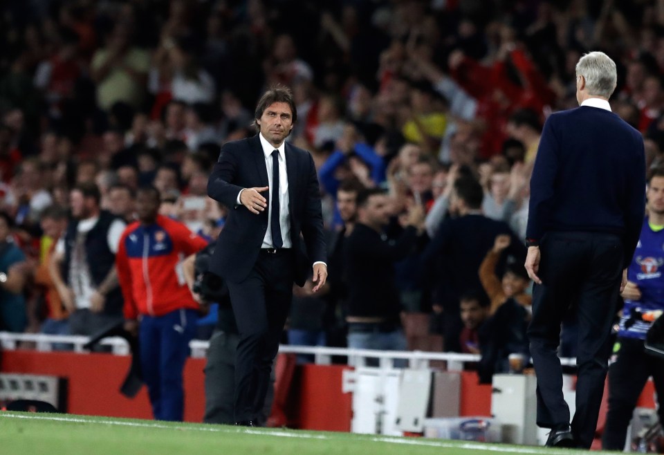  Conte prepares to shake hands afterwards with Arsenal chief Arsene Wenger