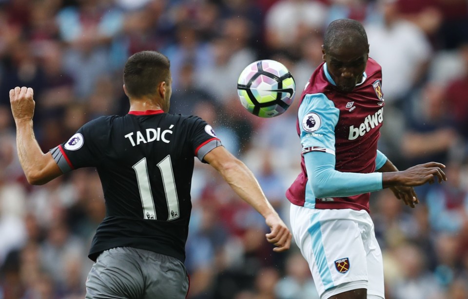  Dusan Tadic challenges Angelo Ogbonna for the ball during the clash