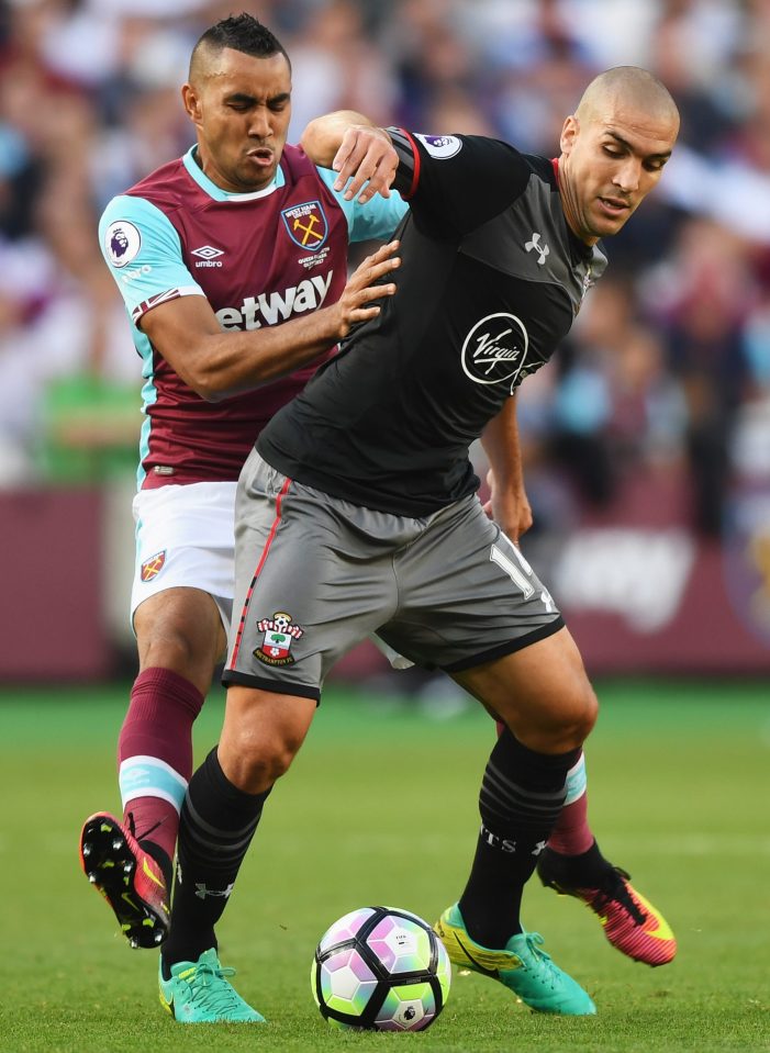  Oriol Romeu shields off Dimitri Payet during the Premier League clash