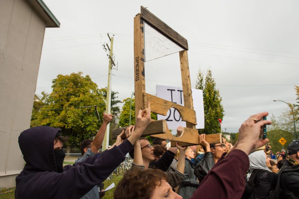  Brandishing a large guillotine the group of protesters appeared to be in the minority