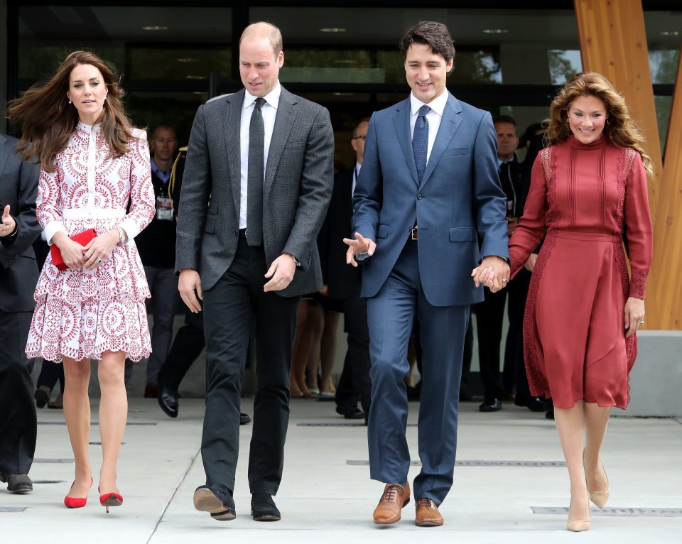 The men chose to walk next to each other, each with their wives on either side