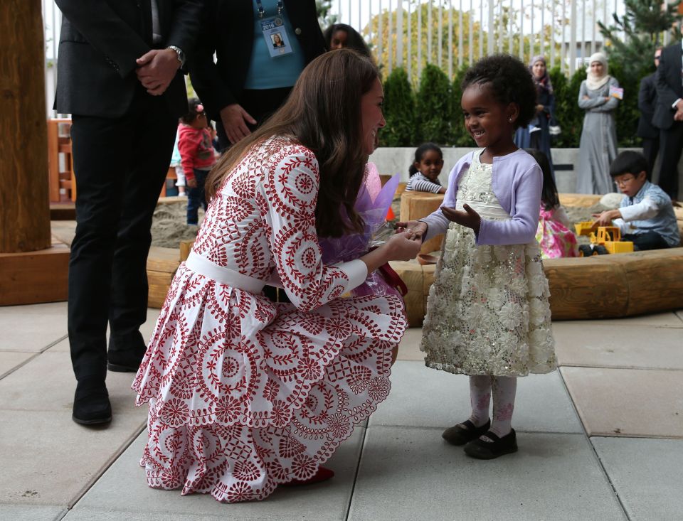 The Duchess of Cambridge receives flowers during her visit to the Immigrant Services Society of British Columbia 