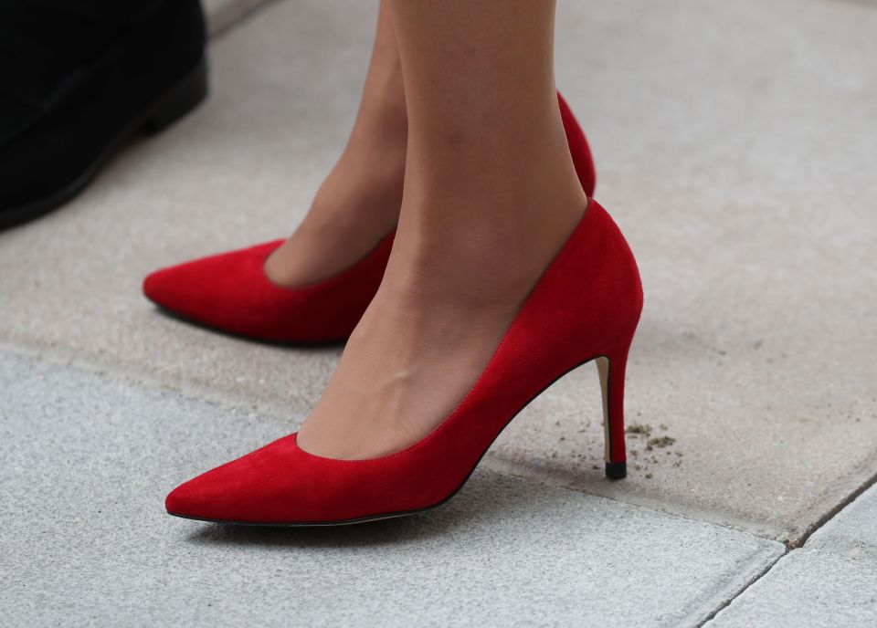 The Duchess' red shoes perfectly matched her bold outfit for the visit