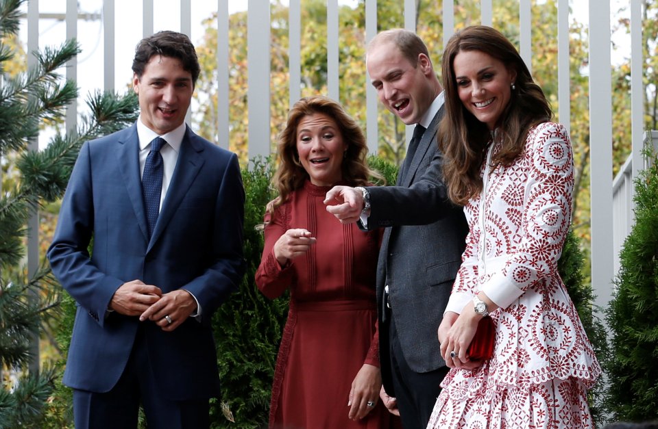 Canada's Prime Minister Justin Trudeau, his wife Sophie Gregoire Trudeau, Britain's Prince William and Catherine, Duchess of Cambridge, react while watching children play