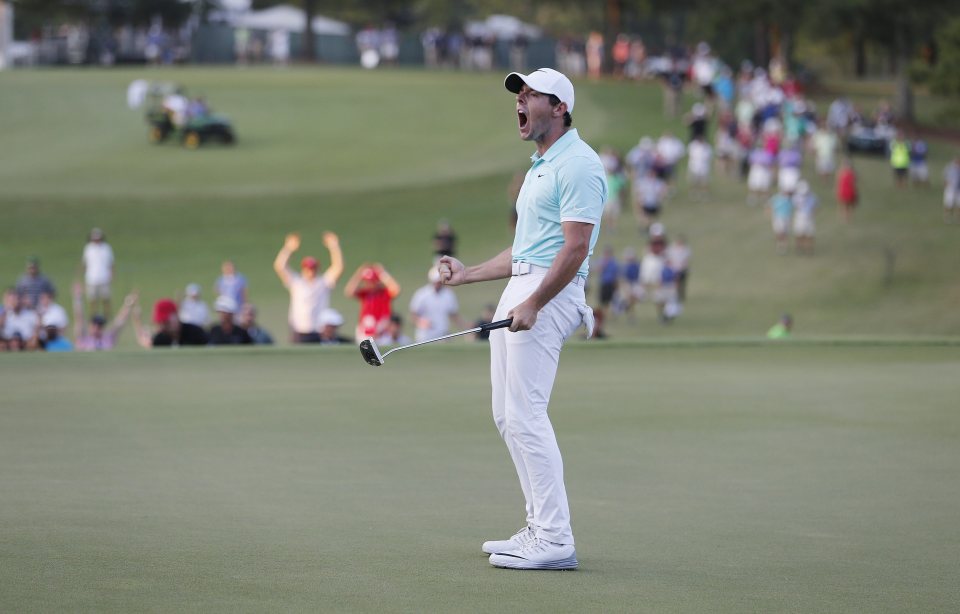  McIlroy reacts after sinking his birdie on the fourth play-off hole