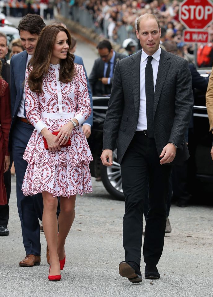  Kate paired her Alexander McQueen dress with red heels and a matching handbag