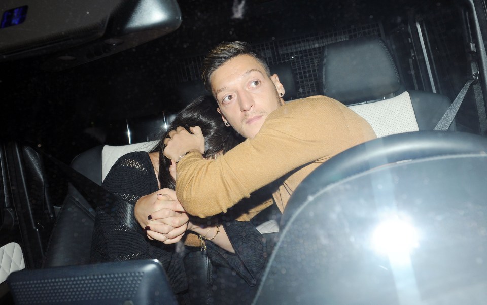  Mesut Ozil hides his girlfriends face but its clear all is not well