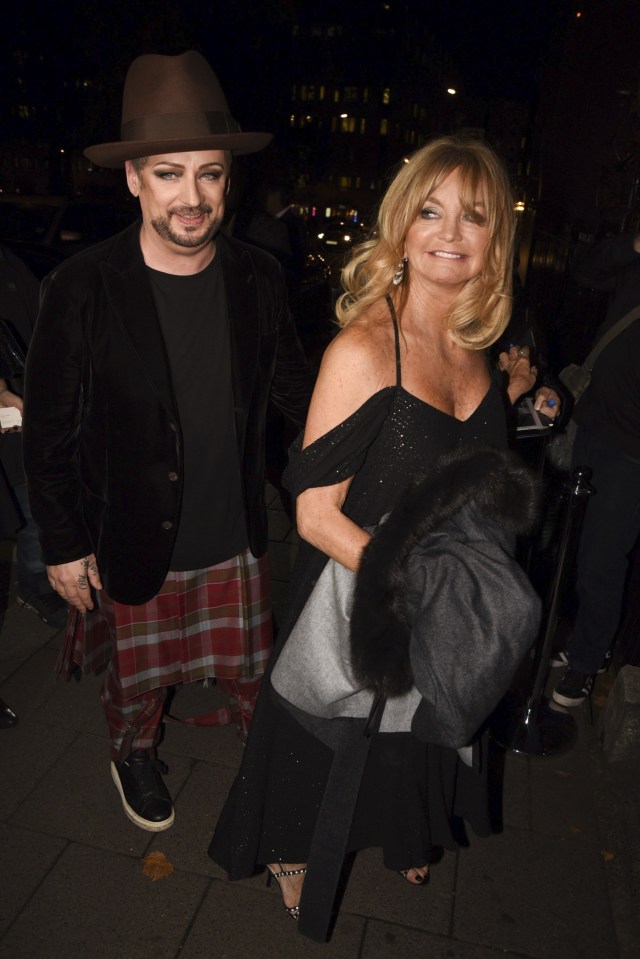  Host of the night Goldie Hawn arrived cosied up to Culture Club singer Boy George