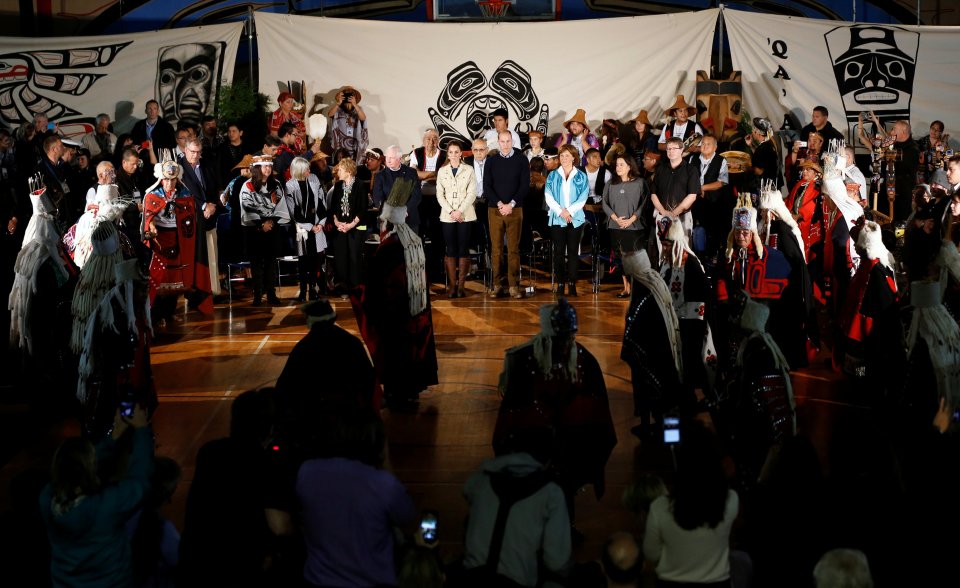 Britain's Prince William and Kate, Duchess of Cambridge, watch aboriginal dancers during an event at the community hall in Bella Bella