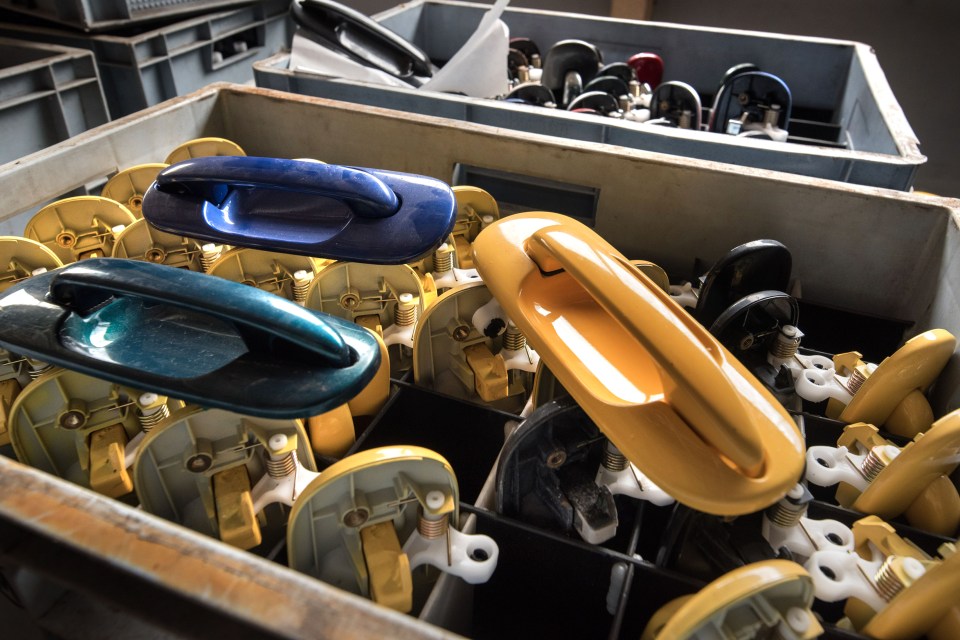  Door handles which will never be attached to cars lie untouched