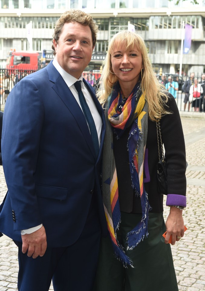  DJ Sara Cox and musical star Michael Ball smile for awaiting cameras