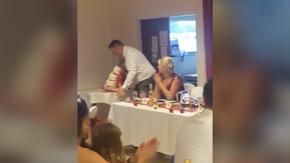  Guests could be heard warning him not to pick up the cake during the video