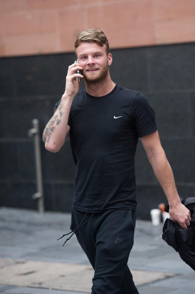 Martin Carroll smiled as he left Manchester Magistrates Court today after he was slapped with a fine for his loutish behaviour