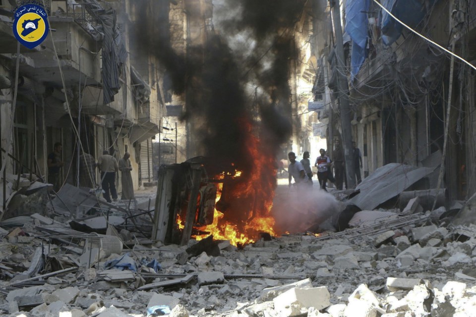  Syrians assess the damage following further airstrikes on Aleppo