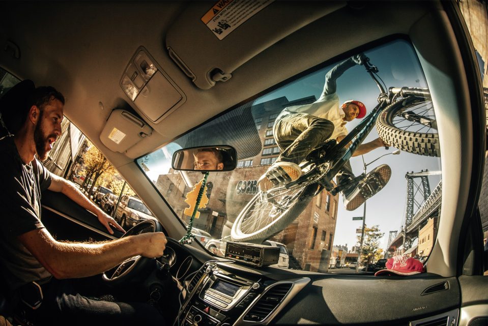  Won by Ale Di Lullo from Italy, for this photo of Aaron Chase riding on the windshield of a taxi in Brooklyn, New York