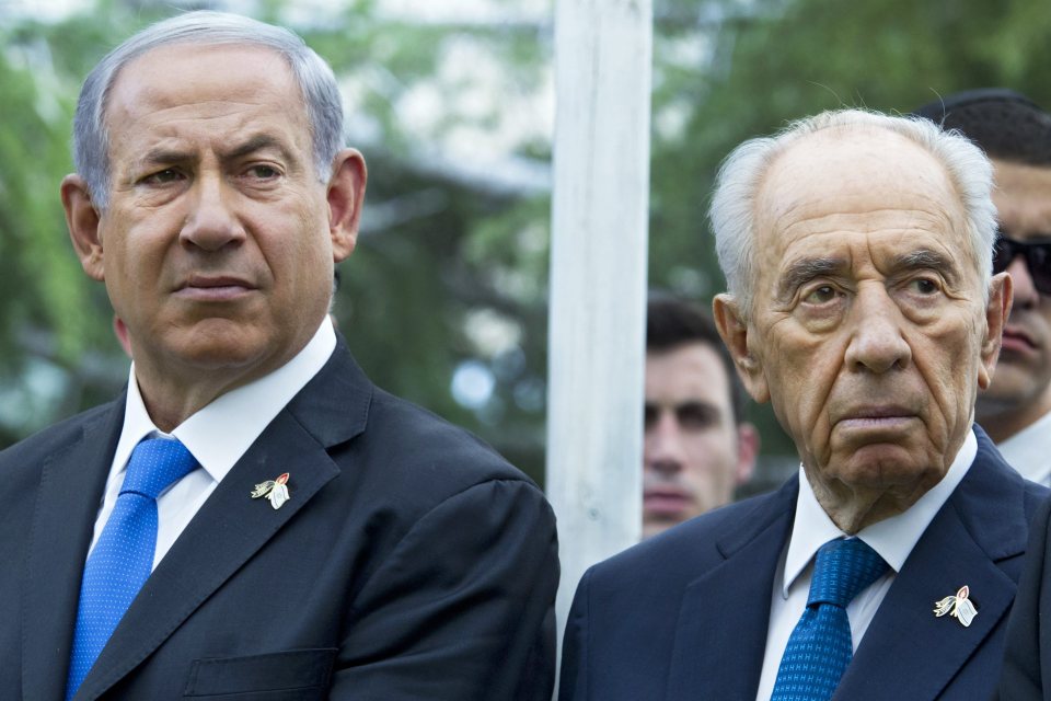 Israeli Prime Minister Benjamin Netanyahu (left) is alleged to have been pulled back from the brink of airstrikes against Iran by then-President Peres