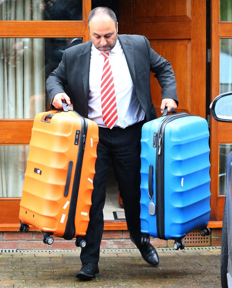  Big Sam's suitcases are carried out of Sam Allardyce's home