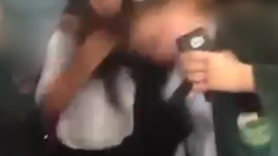  A fight the breaks out with students screaming as one of the girls has her hair pulled