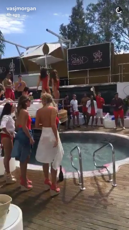  A bevy of bikini clad extras are waiting by the pool