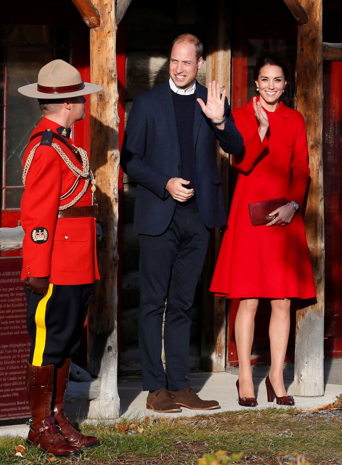 The Duchess wowed onlookers in a bright scarlet coat, from Carolina Herrera