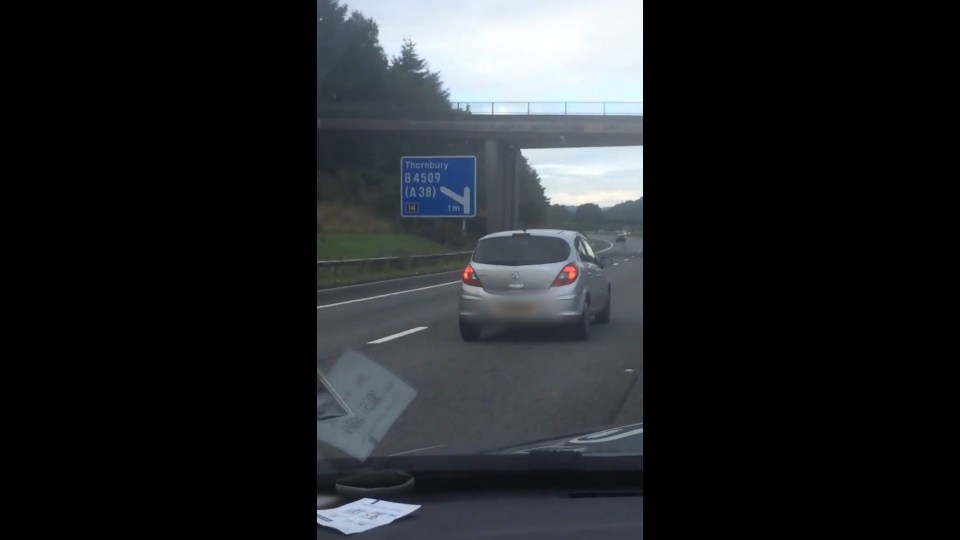  He was filmed by the passenger in another car near junction 14 of the M5 in Gloucestershire