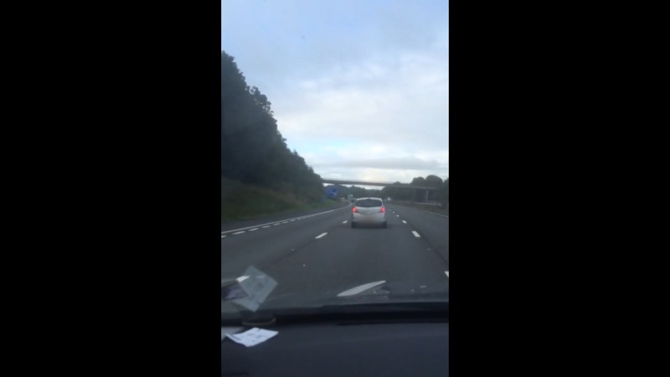  The driver of this silver Vauxhall hogs the middle lane apparently unaware of other road users trying to get past