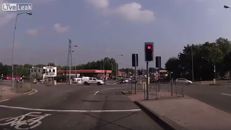  And he's gone: The cyclist makes to the other side as stunned motorists wonder what he was thinking