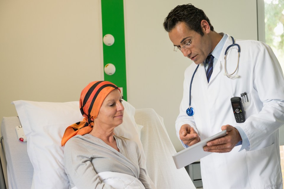 Doctor showing medical report to a patient