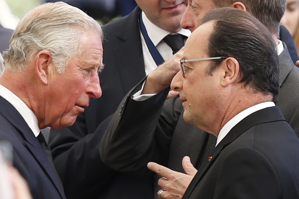  Prince Charles was seen chatting with French President Francois Hollande before the funeral service began