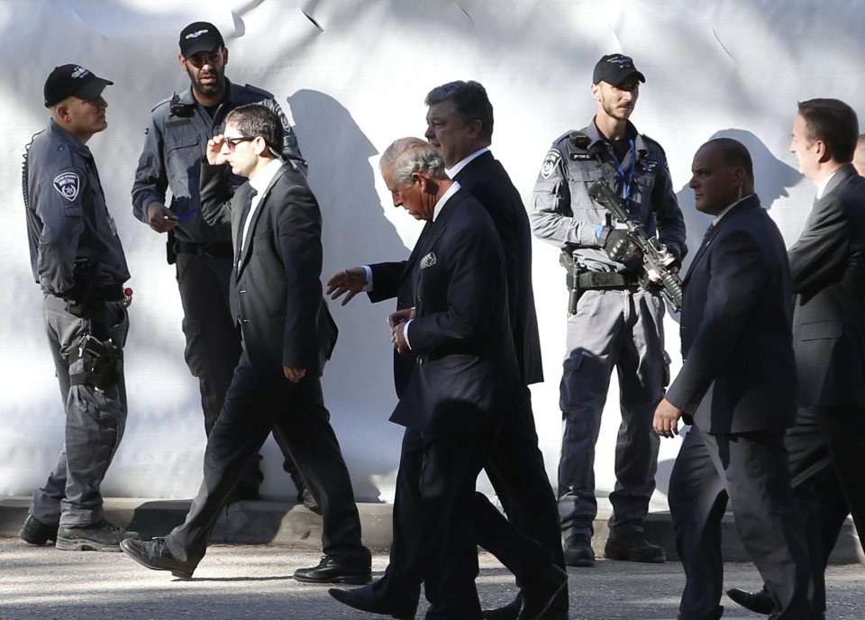  Prince Charles could be seen walking past heavily armed guards as he arrived at the ceremony this morning